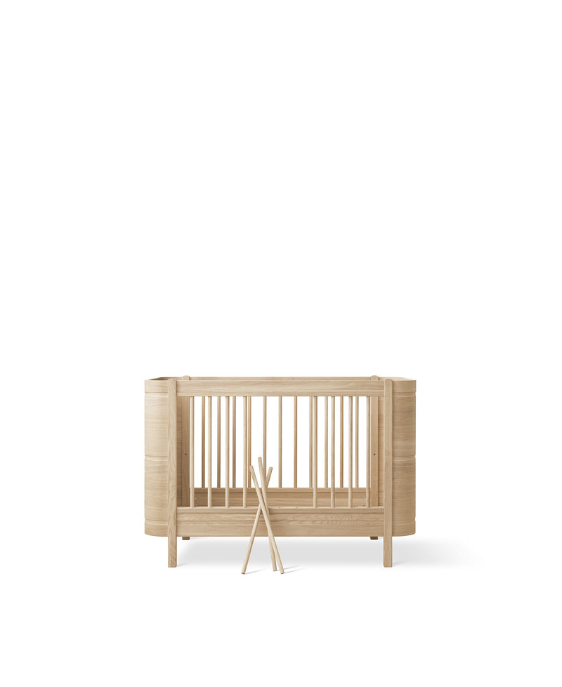 Wood Mini+ cot bed incl. junior kit, oak
