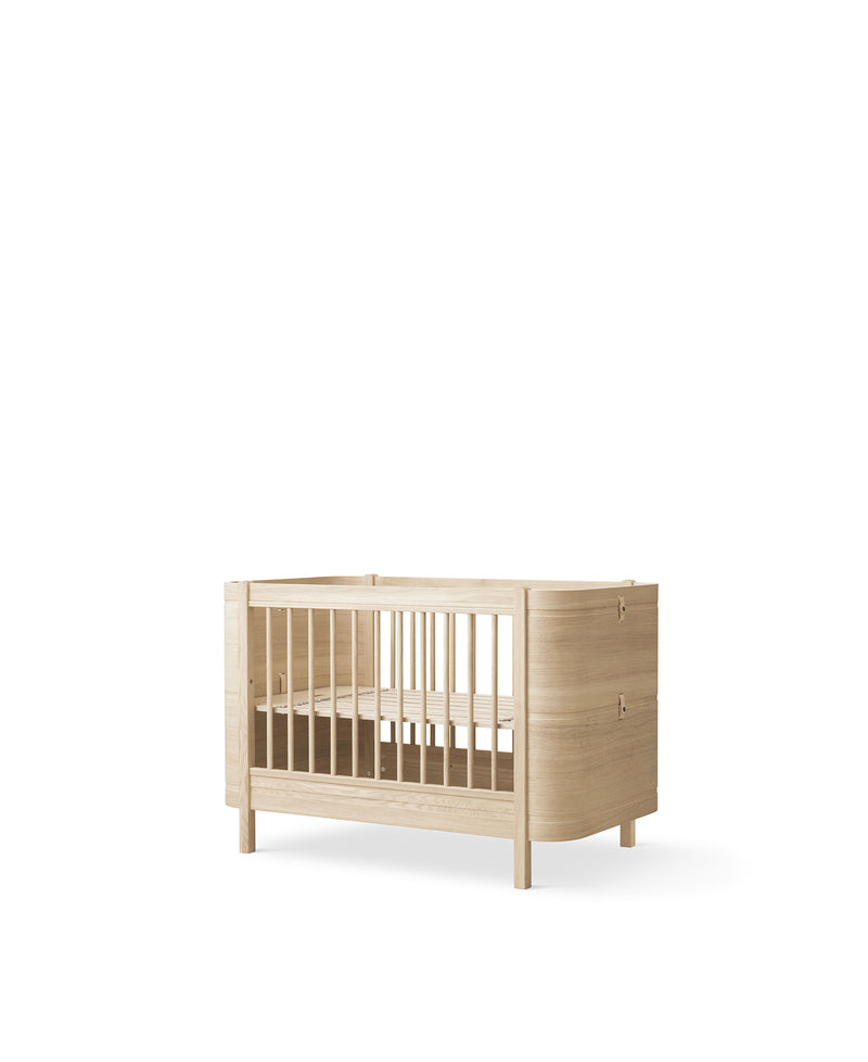 Wood Mini+ cot bed incl. junior kit, oak